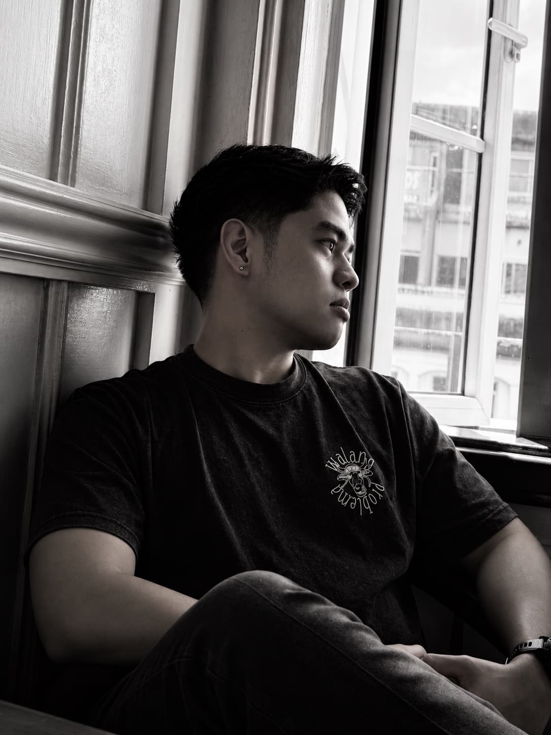 Aian Jade Lesigues seated by a window